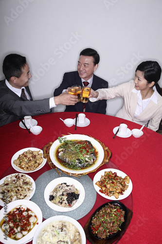 Photo: Business people eating together Business people eating together