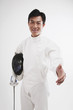 Photo: Man in fencing suit extending hand for a handshake Man in fencing suit extending hand for a handshake