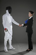 Photo: Man shaking hands with a businesswoman Man shaking hands with a businesswoman