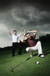 Men playing golf at golf course
