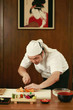 Chef cutting sushi