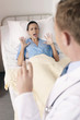 Doctor holding syringe, patient screaming