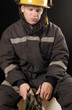 Fire fighter holding protective gloves