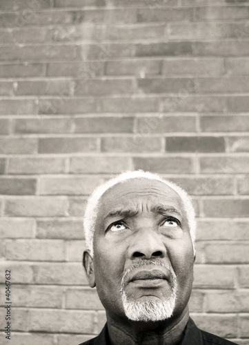 Photo: Senior man looking up Senior man looking up