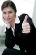 Businesswoman showing thumbs up