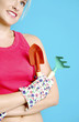 Woman holding trowel and garden fork