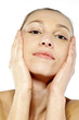Woman touching her face