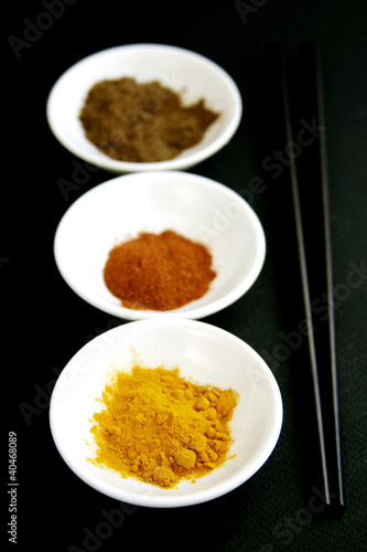 Photo: Three bowl of spices and a pair of chopsticks. Three bowl of spices and a pair of chopsticks.