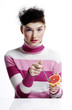 Woman eating orange
