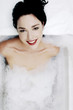Woman soaking in the bathtub