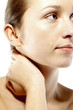 Woman touching her neck while thinking