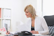 Photo: Senior business woman at work Senior business woman at work