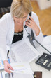 Photo: Senior business woman making phone call. Top view Senior business woman making phone call. Top view