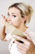 Woman holding a length of tape
