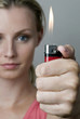 Woman lighting a lighter