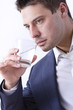 Businessman with glass of water