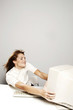 Businesswoman adjusting her computer monitor