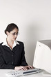 Businesswoman using computer desktop
