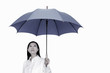 Photo: Businesswoman holding an umbrella Businesswoman holding an umbrella