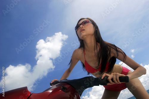 Photo: Woman riding a jet ski Woman riding a jet ski