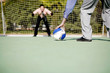 Businessmen playing football