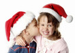 Foto: Boy giving his sister a kiss Boy giving his sister a kiss