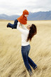 Mother lifting up daughter