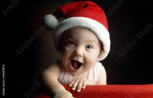 Photo: Baby in christmas hat Baby in christmas hat