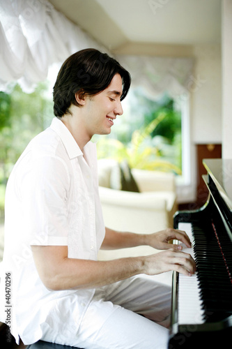 Photo: Man playing piano Man playing piano