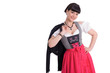 Junge Frau im Dirndl mit Strickjacke