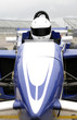 Photo: Front view of a formula one driver in racing car Front view of a formula one driver in racing car