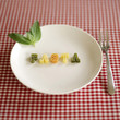 Some alphabet pasta being arranged into a word