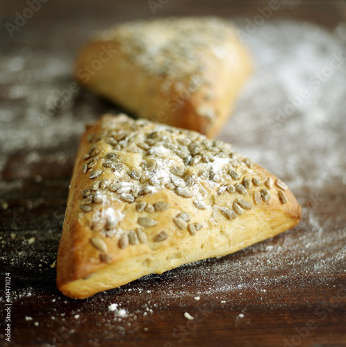 Photo: Close up of the triangular pastry on table Close up of the triangular pastry on table