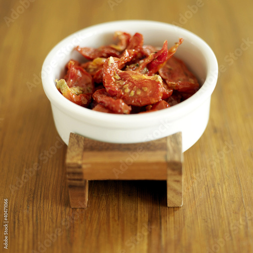 Photo: A small bowl of dried tomatoes A small bowl of dried tomatoes