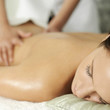 Foto: Woman enjoying a relaxing body massage Woman enjoying a relaxing body massage