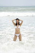 Woman in bikini posing on the beach