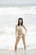 Woman in bikini posing on the beach