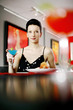 Woman enjoying her meal in a luxurious restaurant