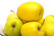 Many yellow apples closeup isolated on white Many yellow apples closeup isolated on white