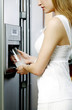 Woman taking water from the refrigerator