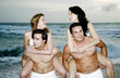 Men carrying their girlfriends on the beach