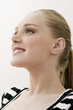 Young woman smiling while looking up