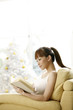 Young woman reading book