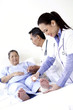 Doctor bandaging patient's ankle