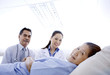 Doctors checking on patient