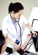 Photo: Doctor measuring blood pressure Doctor measuring blood pressure