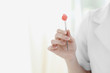 Doctor picking up cotton swab with blood