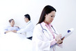 Doctor examining patient in a ward
