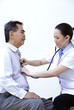Doctor measuring temperature