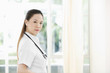 Photo: Female doctor with stethoscope looking at the camera Female doctor with stethoscope looking at the camera